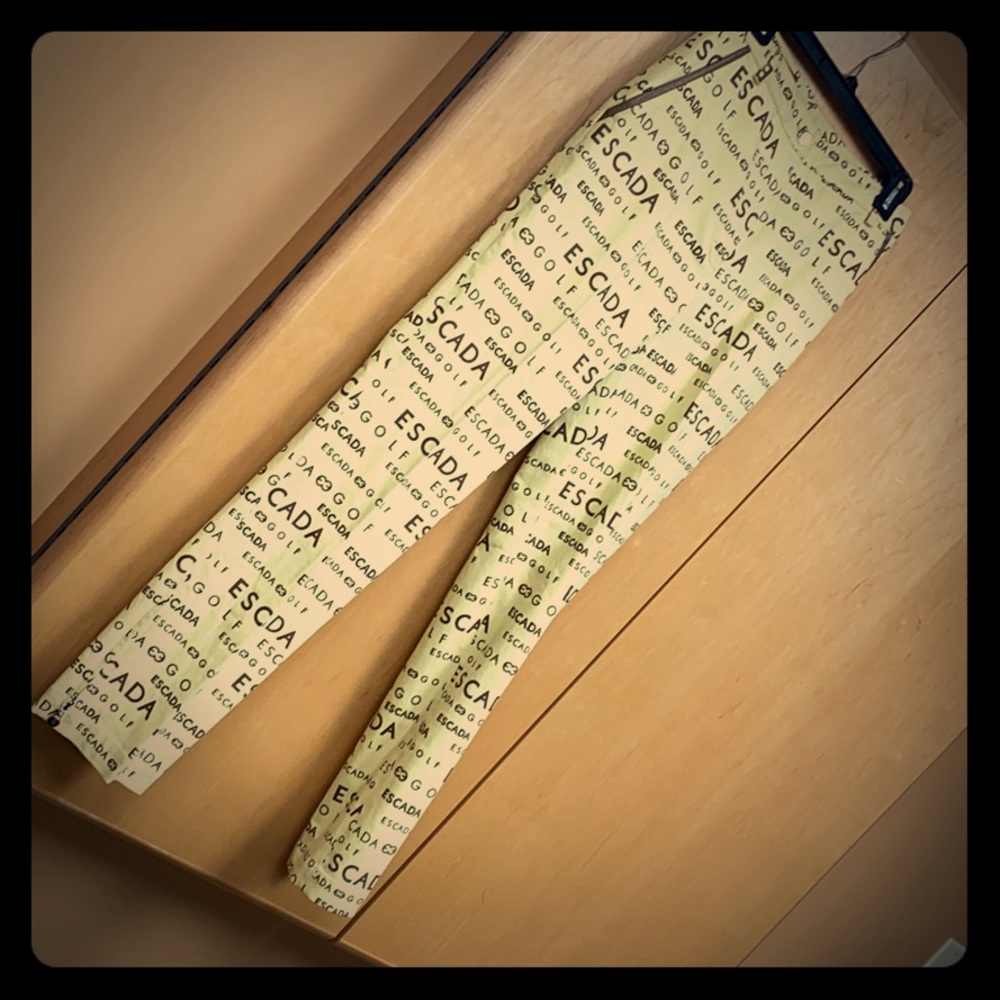 Escada Golf slant pocket trousers w/ logo pattern.